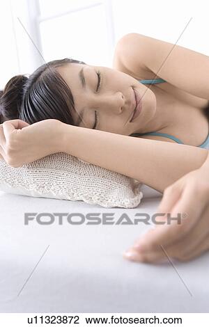 Stock Image - A Young Woman Sleeping, Close Up, Front View. Fotosearch
