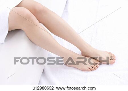 Stock Image - Close-up Image of A Young Woman's Legs, No Face, High Angle View. Fotosearch