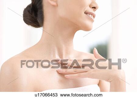 Stock Image - Close-up Image of A Young Woman's Neck, Low Angle View, No Face. Fotosearch
