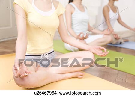 Picture - Three Young Women Practicing Yoga, No Face, Side View. Fotosearch