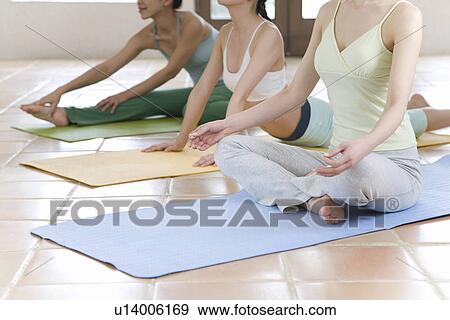Stock Photo - Three Young Women Practicing Yoga, Side View, No Face. Fotosearch