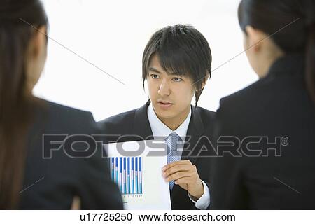 Three young business people in meeting, front view, rear view, white background, Japan View Large Photo Image Stock Image - Three young business people in meeting, front view, rear view, white background, Japan. Fotosearch