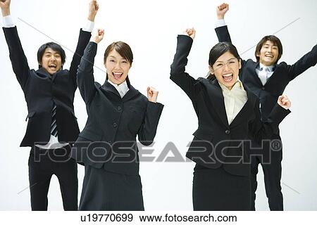 Young business people jumping and punching air, front view, white background, Japan View Large Photo Image Stock Photo - Young business people jumping and punching air, front view, white background, Japan. Fotosearch