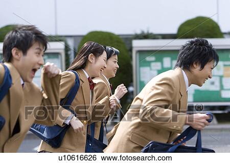 Four high school students smiling and running, side view, Japan View Large Photo Image Stock Photograph - Four high school students smiling and running, side view, Japan. Fotosearch