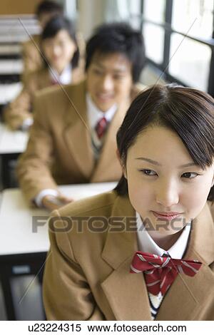High school students sitting at desk in class, high angle view, front view View Large Photo Image Stock Photography - High school students sitting at desk in class, high angle view, front view. Fotosearch