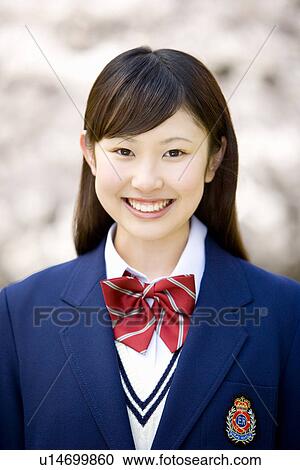 Portrait of a teenage girl smiling and looking at camera, front view, Japan View Large Photo Image Stock Image - Portrait of a teenage girl smiling and looking at camera, front view, Japan. Fotosearch