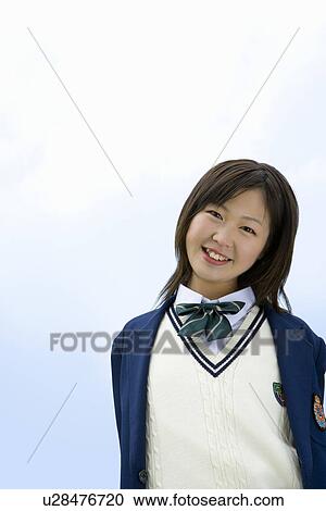 Portrait of a teenage girl smiling and looking at camera under the blue sky, front view, copy space, Japan View Large Photo Image Stock Image - Portrait of a teenage girl smiling and looking at camera under the blue sky, front view, copy space, Japan. Fotosearch
