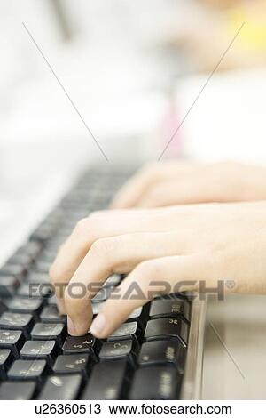 Stock Image - Close Up Image of Hands Typing Keyboard. Fotosearch