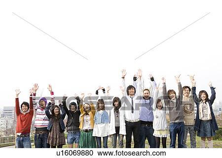 College Students Holding Their Arms in the Air View Large Photo Image Stock Image - College Students Holding Their Arms in the Air. Fotosearch
