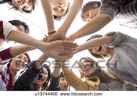 Stock Image - College Students in Huddle. Fotosearch