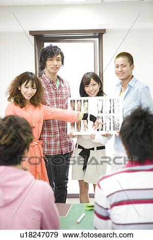 Stock Photo - College Students Making a Presentation in Class. Fotosearch