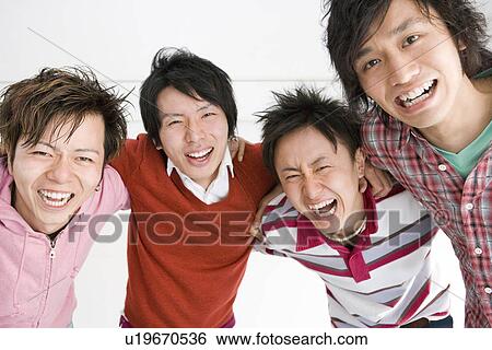 Stock Photograph - Four Young Men Making a Circle. Fotosearch