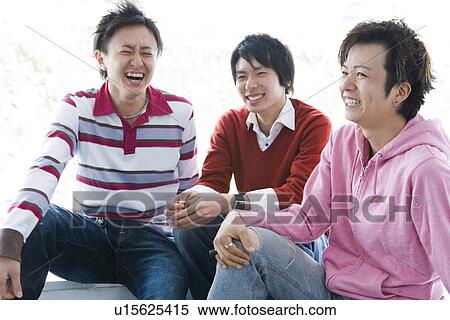 Stock Photography - Three Young Men Sitting on Campus. Fotosearch