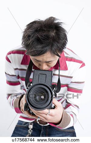 Picture - Young Man Holding Camera. Fotosearch