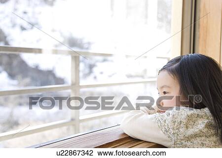 Girl looking outside from the window View Large Photo Image Stock Image - Girl looking outside from the window. Fotosearch