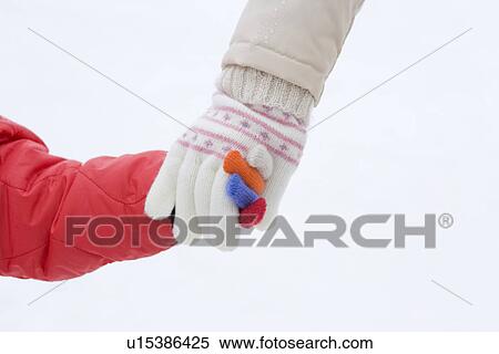 Girl walking with her mother, hand in hand, close up, white background View Large Photo Image Stock Photography - Girl walking with her mother, hand in hand, close up, white background. Fotosearch