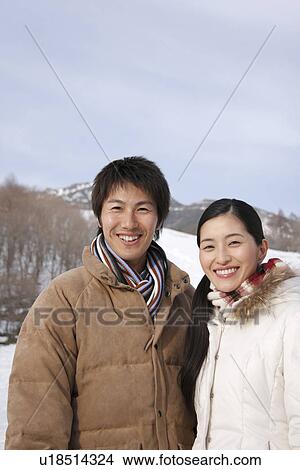 Portrait of a couple in winter, smiling View Large Photo Image Picture - Portrait of a couple in winter, smiling. Fotosearch