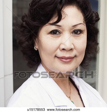 Stock Image - Close-up of a female doctor smiling. Fotosearch