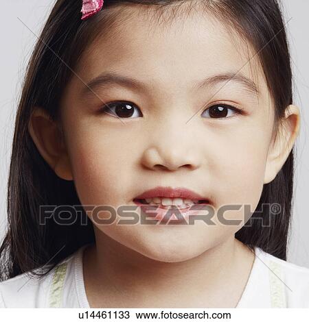 Stock Image - Portrait of a girl smiling. Fotosearch