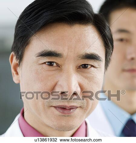 Stock Image - Portrait of two male doctors. Fotosearch