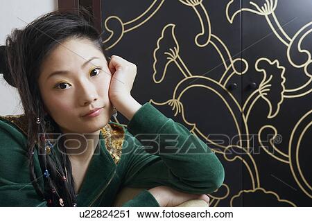 Close-up of a teenage girl thinking View Large Photo Image Stock Image - Close-up of a teenage girl thinking. Fotosearch