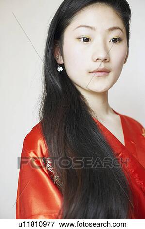 Stock Photo - Close-up of a young woman in a bathrobe. Fotosearch