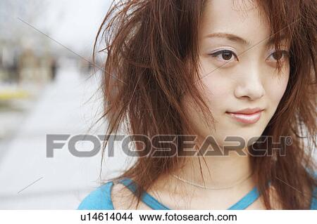 Picture - Close-up of a young woman looking away. Fotosearch
