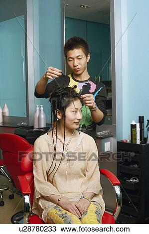 Male hairdresser with teenage girl in a salon View Large Photo Image Stock Image - Male hairdresser with teenage girl in a salon. Fotosearch