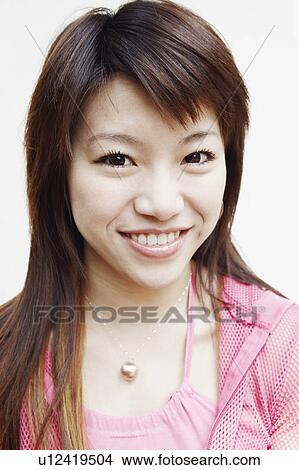 Picture - Portrait of a young woman smiling. Fotosearch