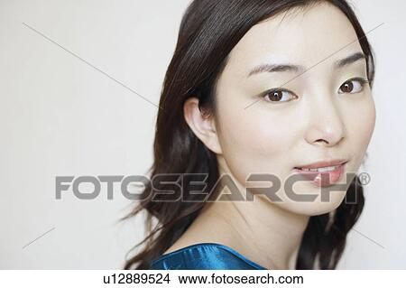 Picture - Portrait of a young woman smiling. Fotosearch