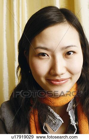 Portrait of a young woman smiling View Large Photo Image Stock Photo - Portrait of a young woman smiling. Fotosearch