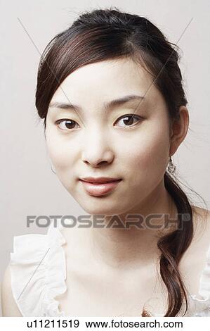 Stock Photo - Portrait of a young woman. Fotosearch