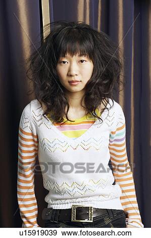 Stock Photo - Portrait of a young woman. Fotosearch