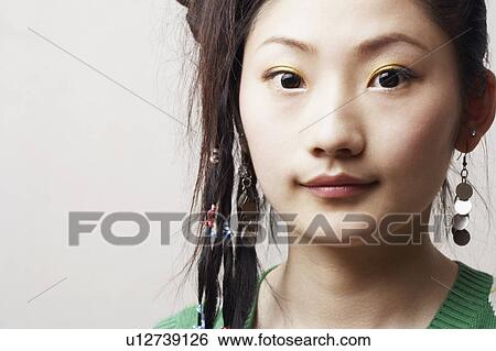 Stock Photograph - Portrait of a young woman. Fotosearch