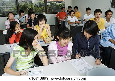 Stock Photo - Close-up of students in a classroom. Fotosearch