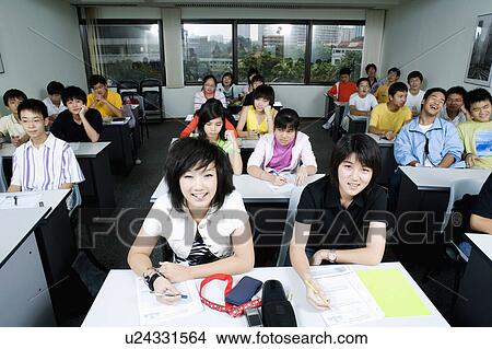 Picture - High angle view of students sitting in a classroom. Fotosearch