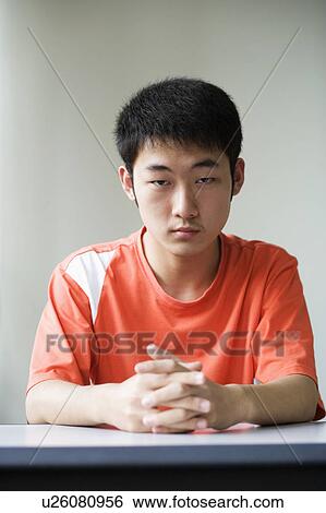 Stock Photograph - Portrait of a boy looking upset. Fotosearch