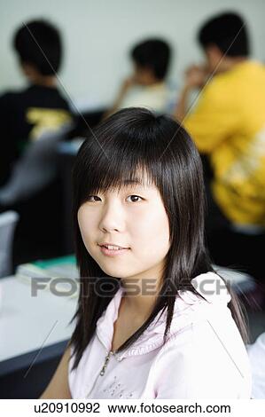 Stock Image - Portrait of a girl smiling. Fotosearch