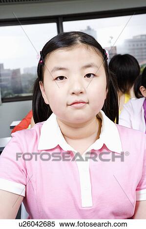 Stock Photography - Portrait of a girl smiling. Fotosearch