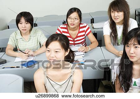 Student sitting in a classroom View Large Photo Image Stock Photo - Student sitting in a classroom. Fotosearch