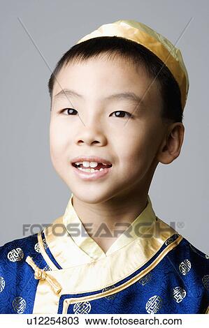 Close-up of a boy smiling View Large Photo Image Stock Image - Close-up of a boy smiling. Fotosearch