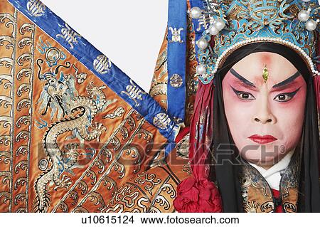 Picture - Close-up of a male Chinese opera performer looking serious. Fotosearch