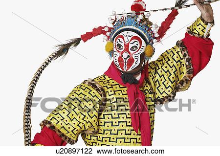 Stock Image - Close-up of a male Chinese opera performer gesturing. Fotosearch