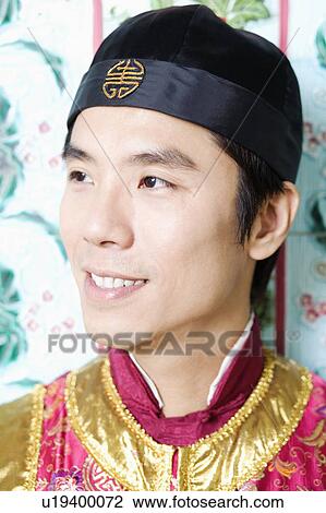 Stock Image - Close-up of a mid adult man smiling. Fotosearch