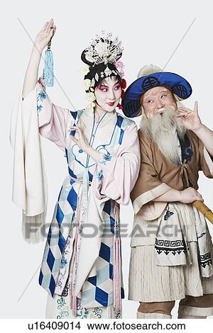Mid adult man and a mature woman wearing traditional clothing View Large Photo Image Picture - Mid adult man and a mature woman wearing traditional clothing. Fotosearch