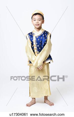 Portrait of a child in traditional clothing View Large Photo Image Stock Image - Portrait of a child in traditional clothing. Fotosearch