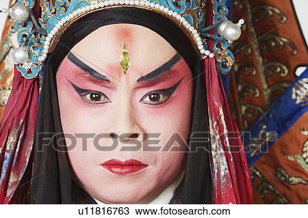Stock Image - Portrait of a male Chinese opera performer looking serious. Fotosearch