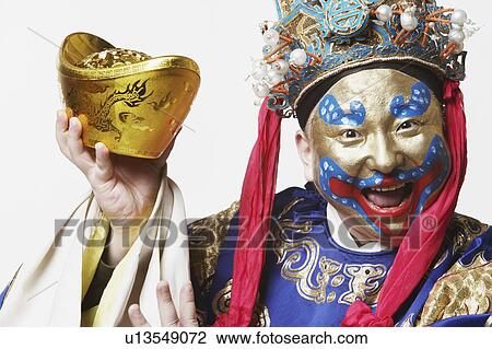 Portrait of a male Chinese opera performer holding a bowl full of gold coins View Large Photo Image Stock Image - Portrait of a male Chinese opera performer holding a bowl full of gold coins. Fotosearch
