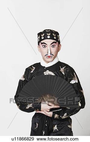 Portrait of a male Chinese opera performer holding a fan View Large Photo Image Stock Photo - Portrait of a male Chinese opera performer holding a fan. Fotosearch