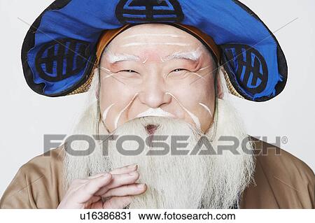 Stock Image - Portrait of a mid adult man wearing traditional clothing. Fotosearch